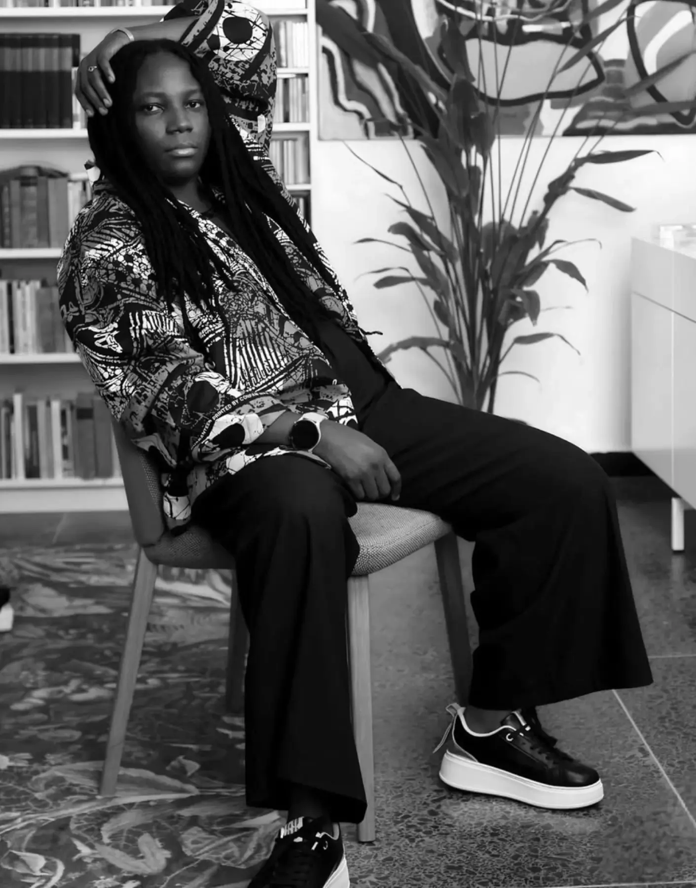 Ema Edosio seated, black and white portrait
